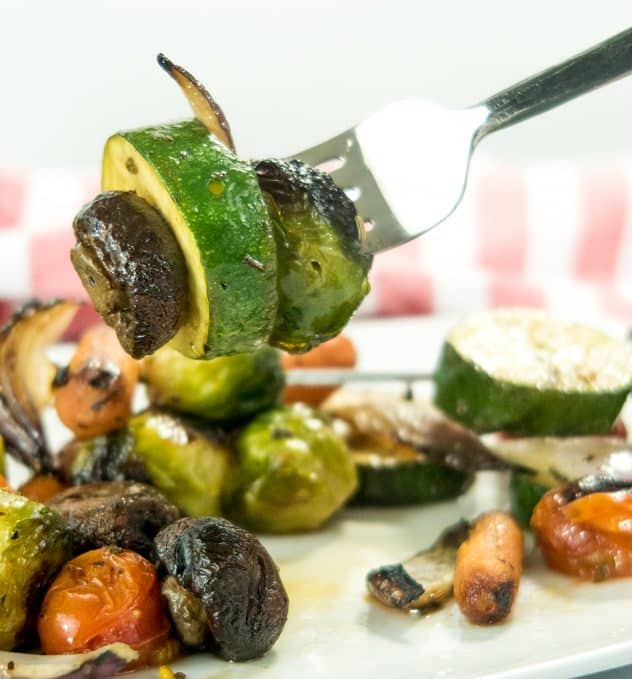 grilled mushroom, zucchini and brussel sprout on a fork