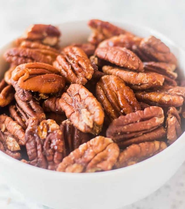 Maple Cinnamon Roasted Pecans in a white bowl.