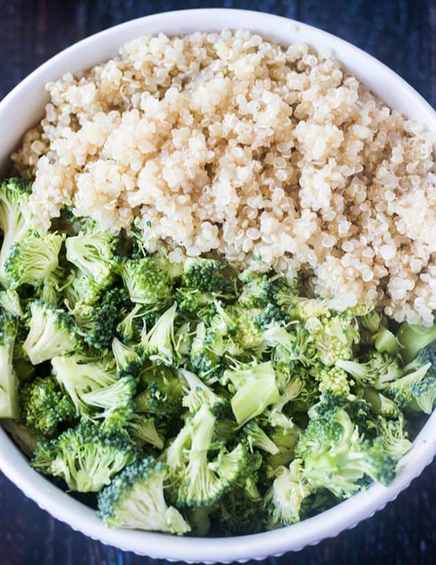 Cooked Quinoa and Chopped Raw Broccoli in a bowl.