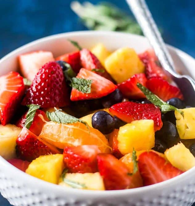 Summer Fruit Salad in a white bowl.