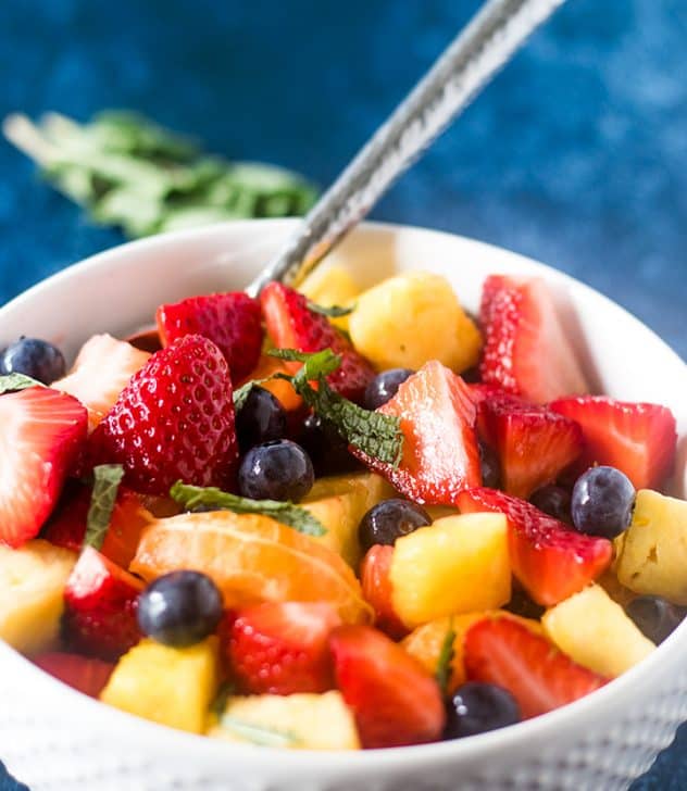 Summer Fruit Salad in a white bowl.