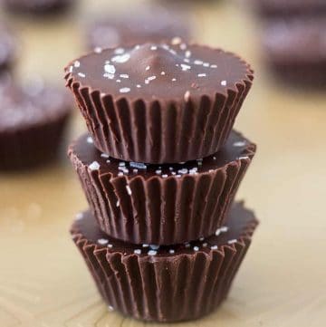 Three Cashew Nut Butter Cups stacked on top of each other.