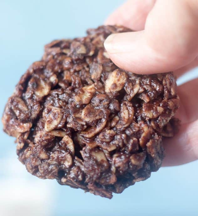 Holding a Chocolate Oatmeal No Bake Cookie in hand.