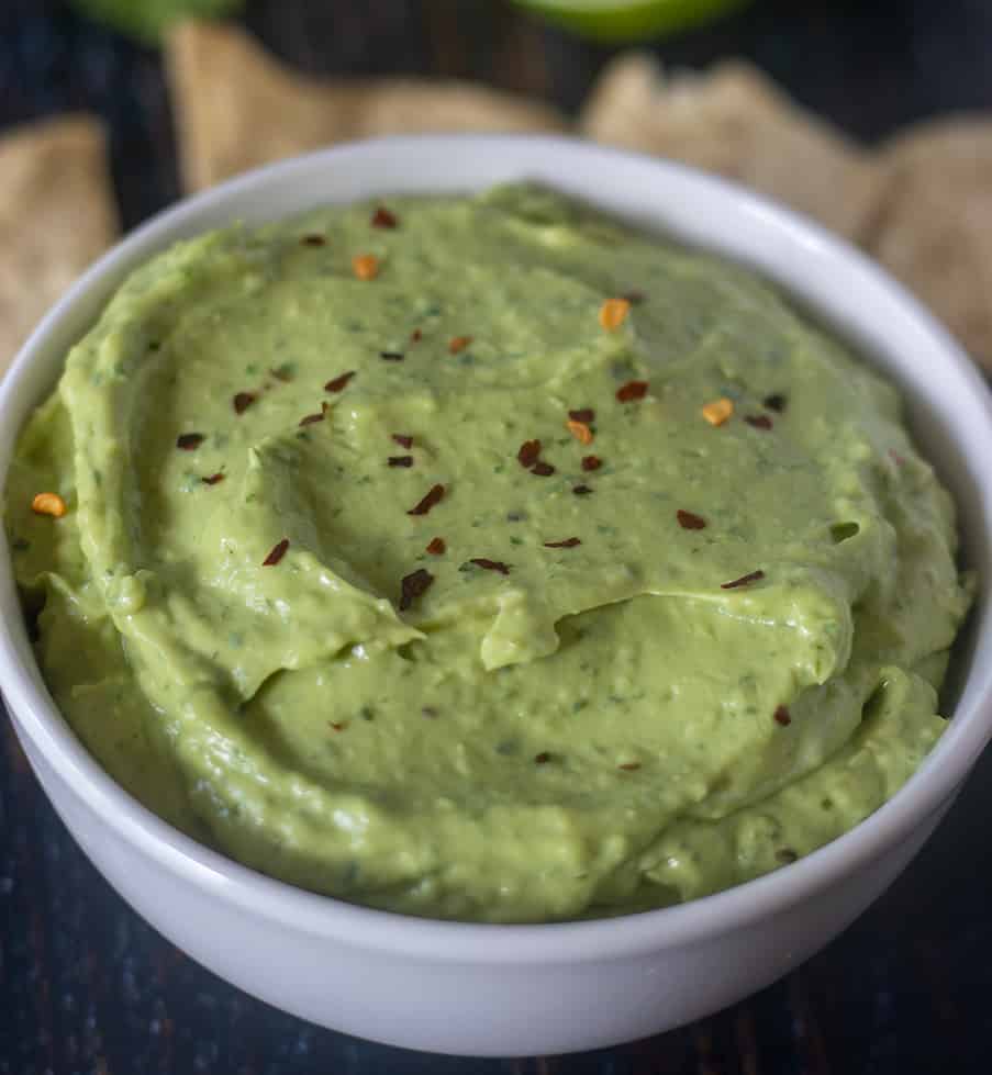 Avocado dip garnished with red chili flakes