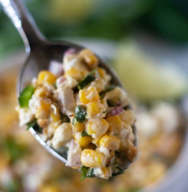 Mexican Street Corn Salad on a spoon.