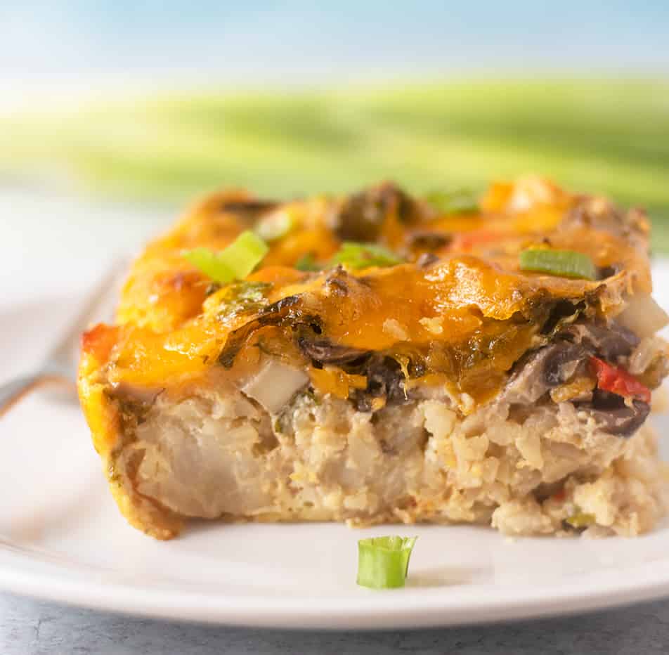 Tater Tot Breakfast Casserole on a plate with a fork