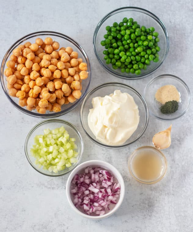 Chickpeas, Green peas, celery, red onion, mayo, ACV, garlic, seasonings.