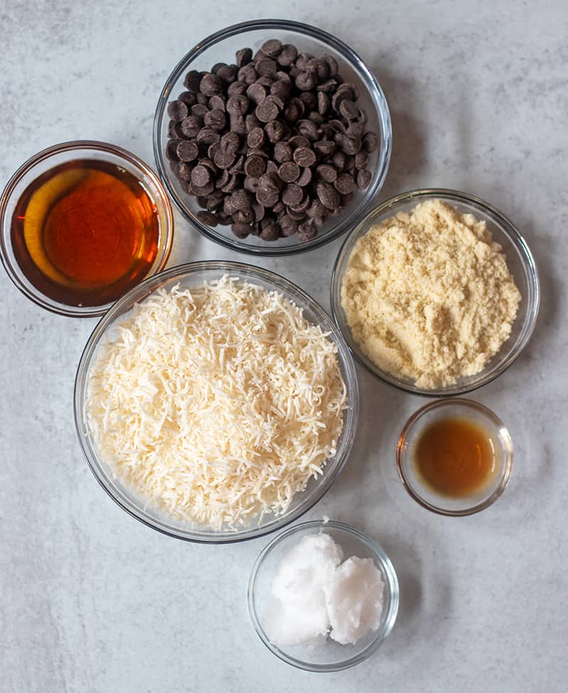 maple syrup, shredded coconut, dark chocolate chips, almond flour, vanilla extract, coconut oil