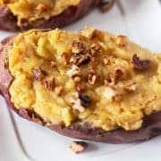 Twice baked sweet potatoes topped with toasted pecans.