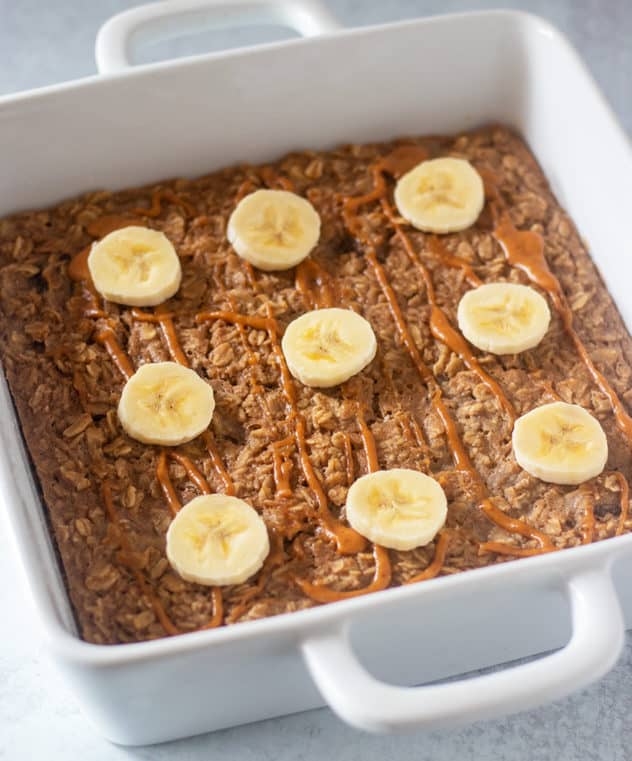 peanut butter banana baked oatmeal drizzled with extra peanut butter and topped with banana slices.