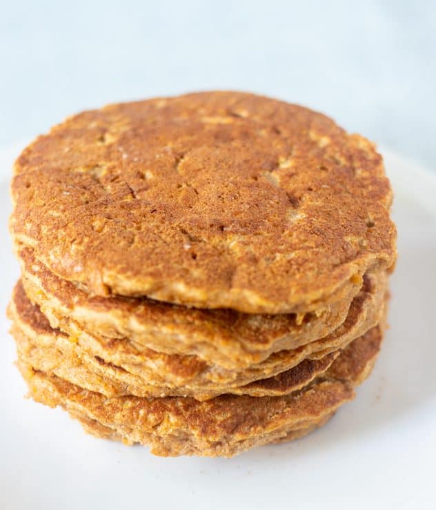 Sweet potato pancakes stacked on a plate