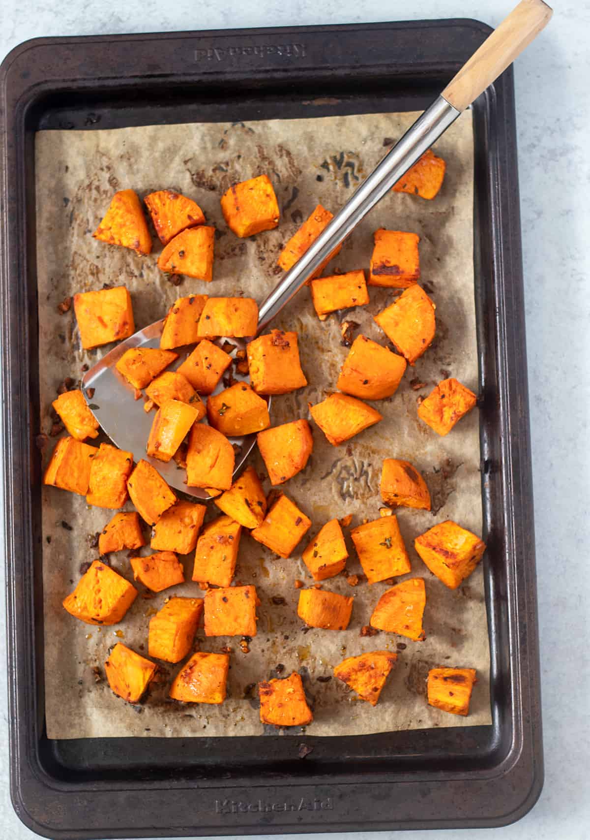 roasted sweet potatoes on baking sheet after being baked