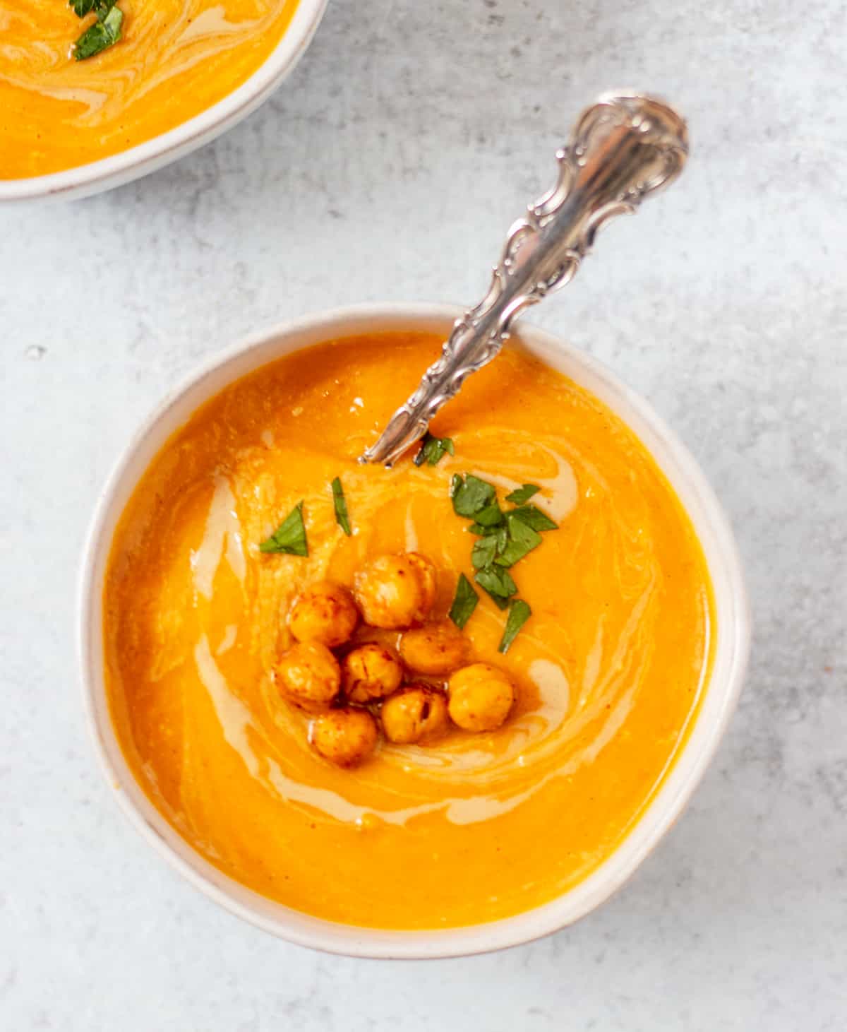  soup garnished with roasted chickpeas and chopped parsley