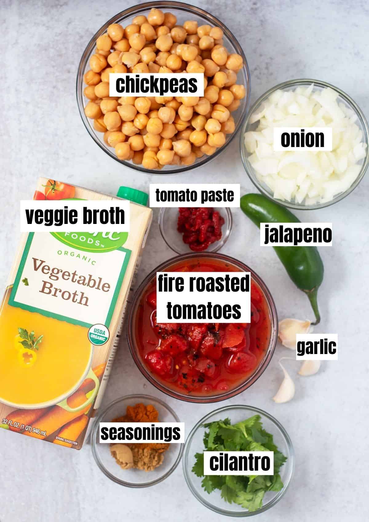 chickpeas, chopped onion, vegetable broth, tomato paste, jalapeno, fire roasted tomatoes, garlic, seasonings, cilantro