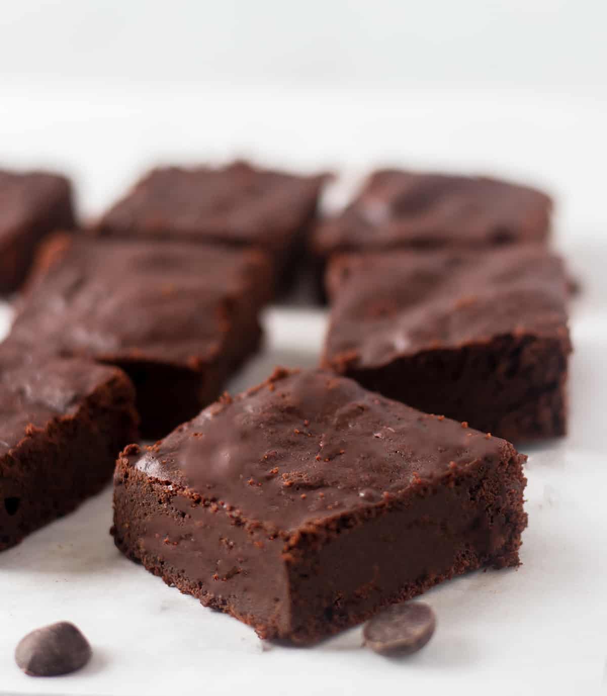 flourless brownies on parchment lined tray