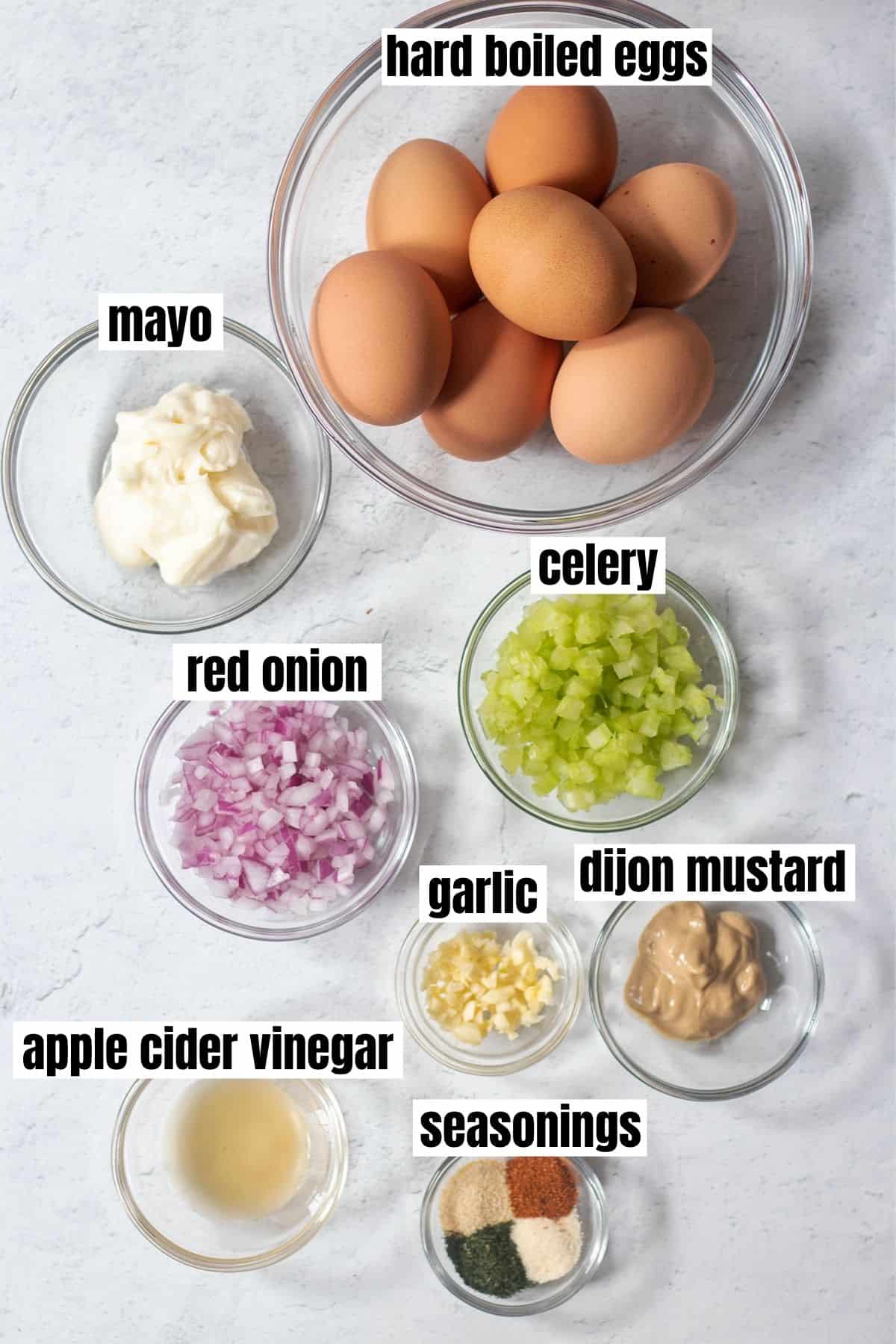 hard boiled eggs, mayo, chopped celery, chopped red onion, diced garlic, dijon mustard, apple cider vinegar and seasonings.
