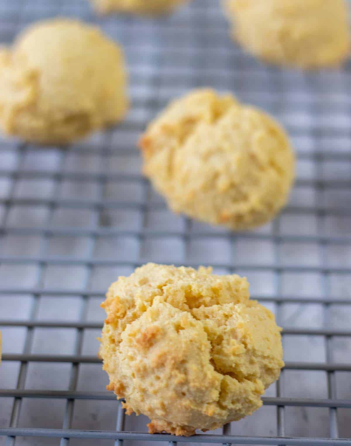 almond flour biscuits on wire cooling rack.