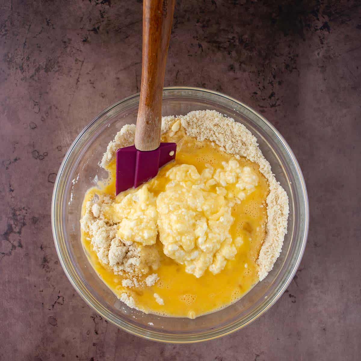 Eggs, butter & cream cheese add to almond flour, baking powder and salt.