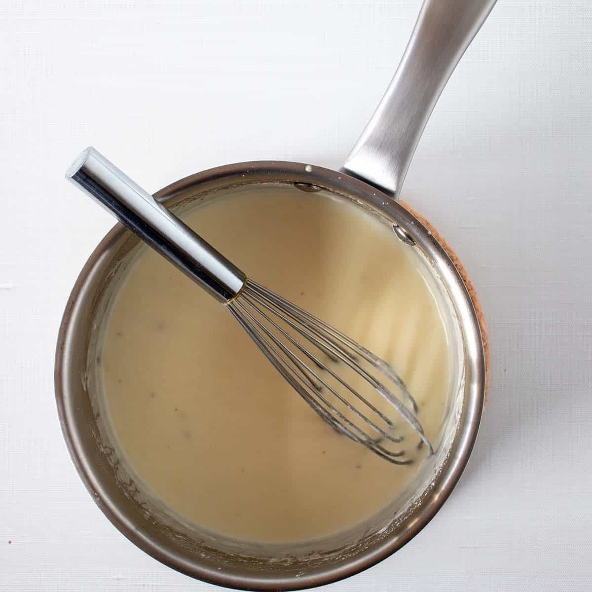 greek yogurt and half & half cream added to butter mixture and whisked together in saucepan.
