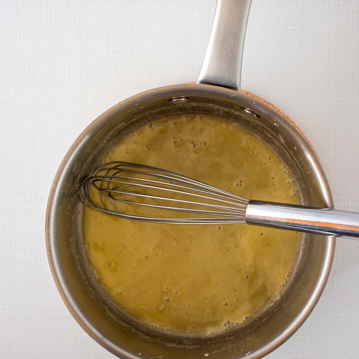 melted butter with cornstarch and seasonings in sauce pan.